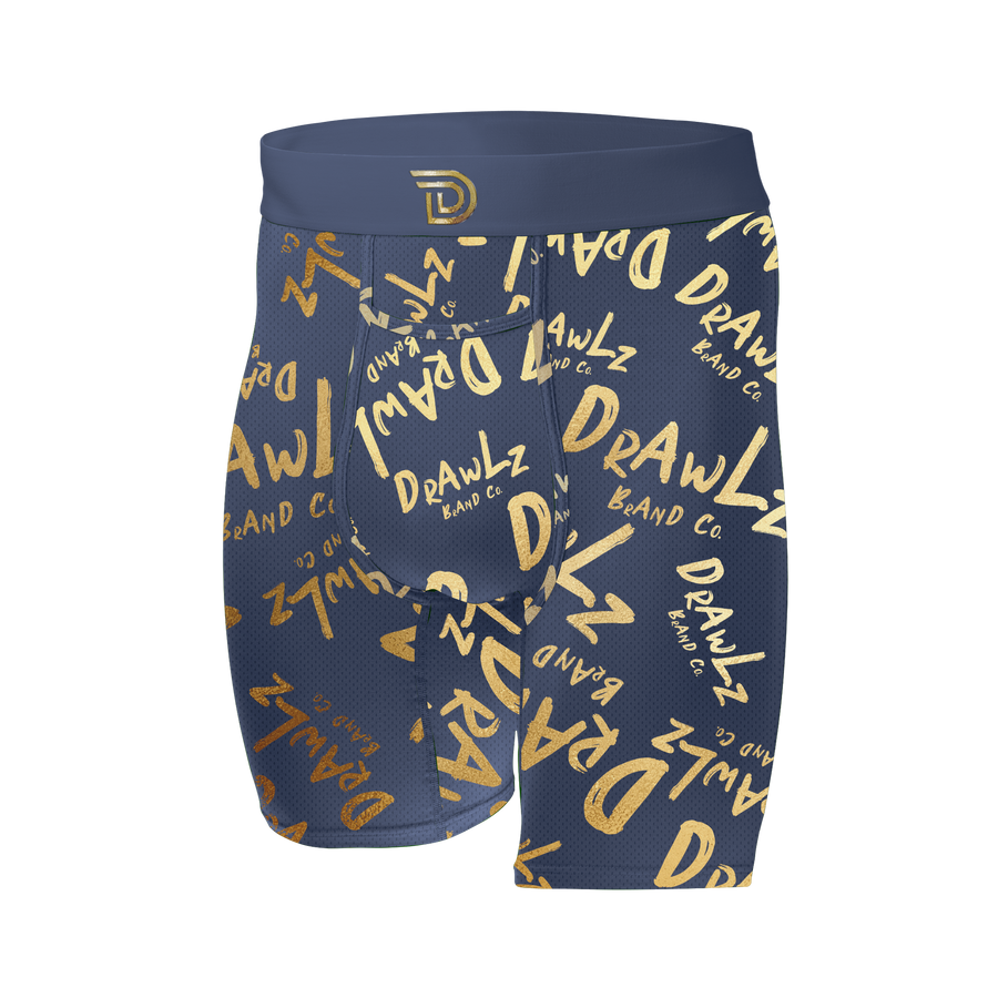 Anniversary Signature — men's navy boxer briefs with gold Drawlz-script print, limited edition
