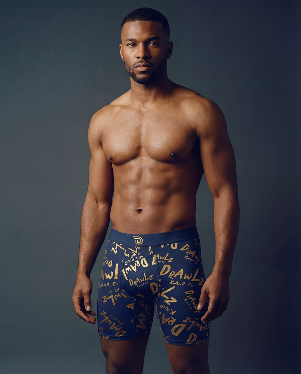 Anniversary Signature — men's navy boxer briefs with gold Drawlz-script print, limited edition, additional view