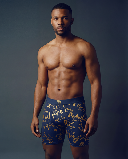Anniversary Signature — men's navy boxer briefs with gold Drawlz-script print, limited edition, additional view